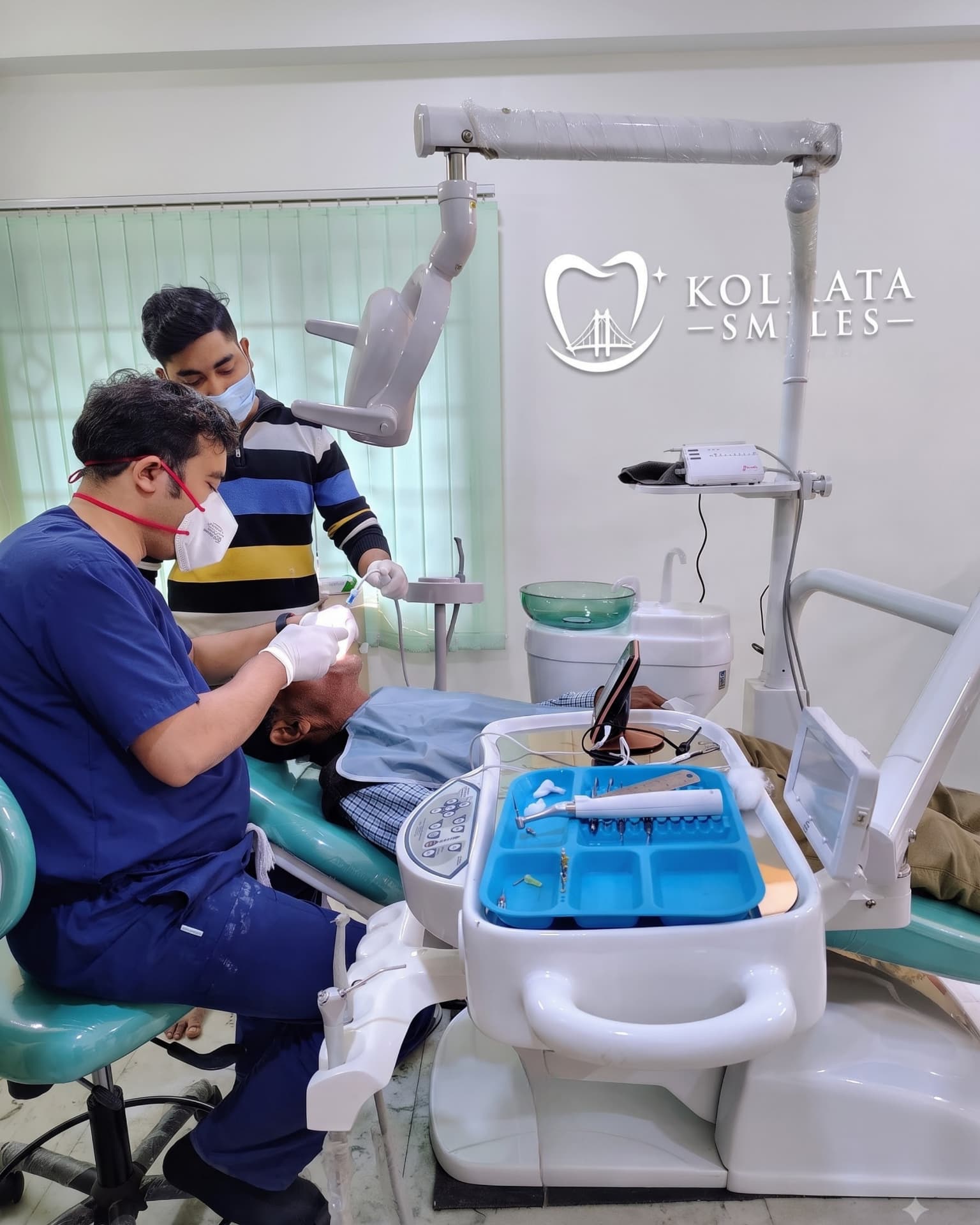Dr. Anandam Bandyopadhyay treating a patient at Kolkata Smiles dental clinic in Dum Dum, Kolkata